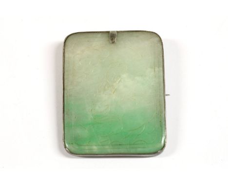 A jade plaque brooch, engraved with a figure in a landscape scene and character marks to reverse of a poem relating to prunus