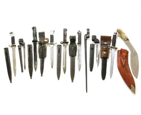 A collection of military bayonets and daggers, together with a Kukri and scabbard (10)