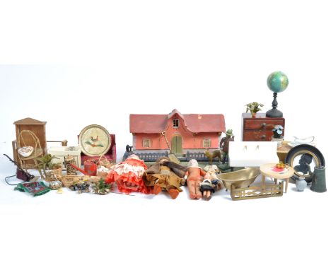 A collection of antique and vintage dolls house figures / doll's and accessories to include; an antique German model of a cot