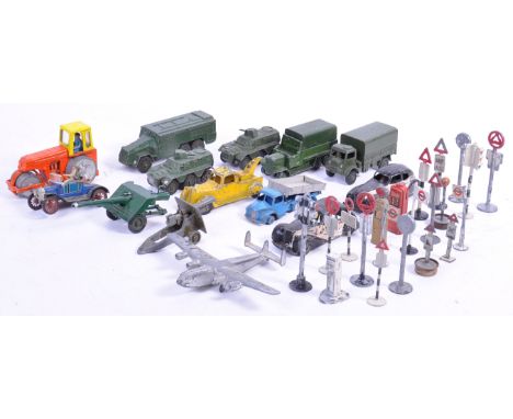 A collection of early diecast Dinky Toys made diecast models and road signs (and some others). Comprising of Dinky Military m