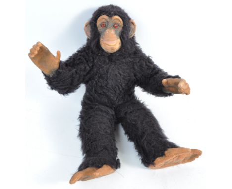 An original vintage 1930's antique stuffed toy bear animal monkey chimpanzee ape having rubber hands, feet and face with red 