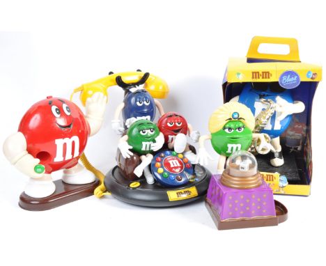 A collection of original Mars licensed M&amp;M merchandise advertising point of sale figures comprising a three character hom