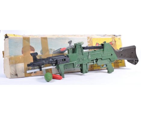 A rare original vintage Tri-ang / Triang made ' Johnny Seven - One Man Army ' machine gun ' Seven Guns In One ' playset. The 