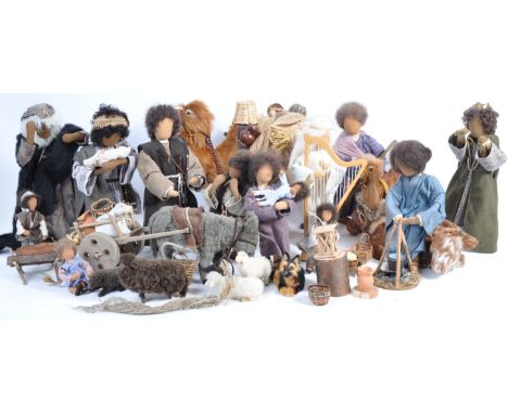 A charming vintage believed mid-20th century set of Christmas Nativity figures. Each dressed in a hand made outfit with weigh