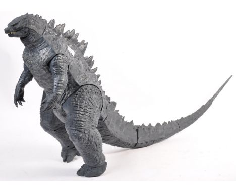 An impressive large scale action figure of Godzilla - the tail removable in several sections. Used as a shop window display f