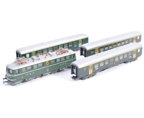 An original Marklin H0 scale model railway train set locomotive and carriage set comprising a SBB CFF 11414 pantograph locomo