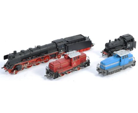 A collection of 4x original Marklin H0 scale model railway train set locomotive engines comprising a blue DHG 500 Start Up Lo