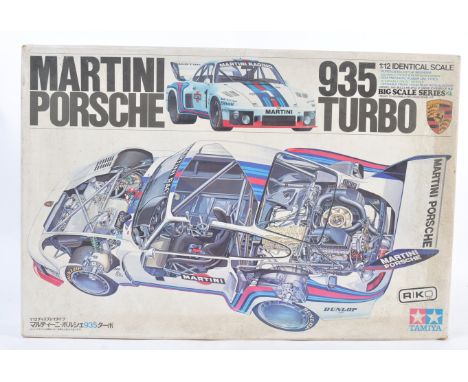 An original Tamiya GC2005 Martini Porsche 935 Turbo 1/20 scale plastic model car kit. The main body of the car appears ready 