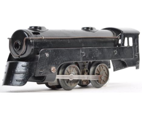 An original vintage Marx made 0 gauge model railway American electric train set locomotive. The loco being an 0-4-0 example p