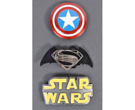 A collection of three retro TV / Film related enamel on metal belt buckles comprising of a Star Wars example, Marvel Captain 