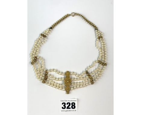 3-strand choker style pearl necklace with 9k gold fasteners and chain and set with 15k gold tiepin, total w: 31.5 gms