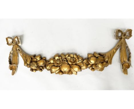ARCHITECTURAL WALL MOUNT, early 19th century Italian carved giltwood of swag form with pineapple and other fruits, 128cm W.