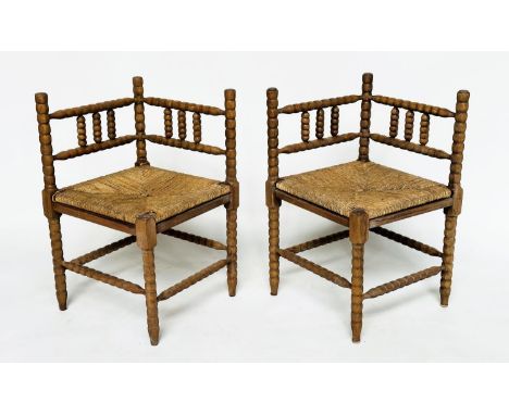 CORNER CHAIRS, a pair, late 19th century oak bobbin turned with rush seats, 59cm W. (2)