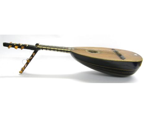 Interesting early double-headed baroque style lute, the angled head with thirteen boxwood tuning pegs, the straight head with