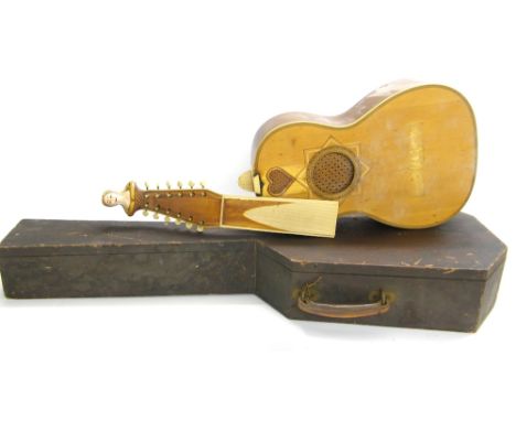 Unusual guitar shaped lute in need of restoration, within an old wooden small-bodied guitar case