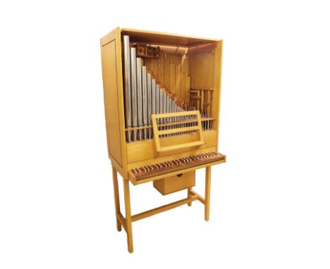 Small three-stop pipe organ ascribed to Peter Collins, Redbourn, circa 1975, the case of oak, the keyboard, compass four octa