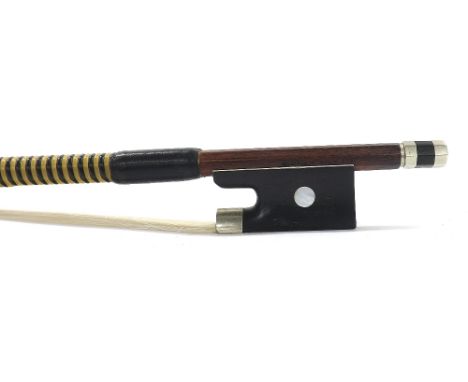 Nickel mounted violin bow stamped A. Lamy a Paris, the stick round, the ebony frog inlaid with pearl eyes and the ebony adjus