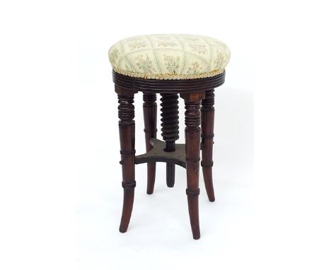 Edwardian mahogany adjustable music stool, with circular stuffover pad seat upon four turned legs united by an undertier