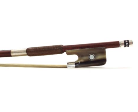 Silver mounted violoncello bow stamped Vtor Fetique a Paris, the stick octagonal, the bone frog inlaid with silver rings encl