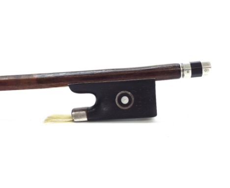 French silver mounted violin bow by and stamped C. Thomassin a Paris, the stick round, the ebony frog inlaid with silver ring