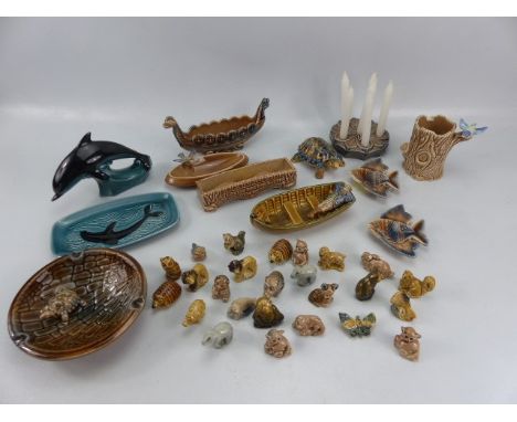 Selection of Wade Whimsies and larger Wade figures along with Poole pottery dolphin and small trinket dish. 
