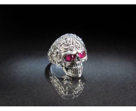 Unusual silver Skull ring set with ruby coloured eyes 