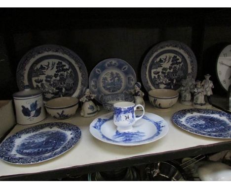 A shelf of blue and white china etc