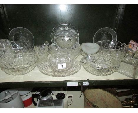 A shelf of glass ware