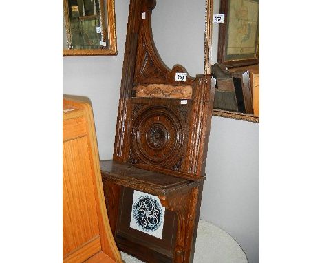 A mahogany shelf unit with tile