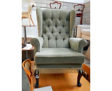 A deep button armchair