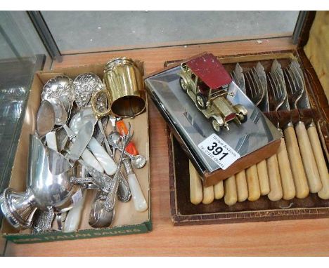 A shelf of cutlery etc.