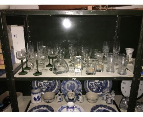 A shelf of glass ware