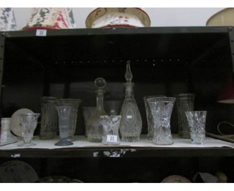 A shelf of glass ware