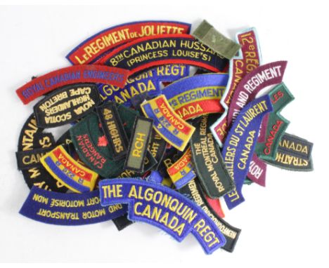 Cloth Badges: Canadian Army Post-War shoulder title badges in excellent condition.   (approx 50+ Items).