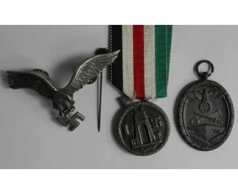 German WW2 West Walls Medal, Germany/Italy Africa Campaign Medal, Nazi NSDAP stick pin maker marked RZM M.11/1, and a Luftwaf