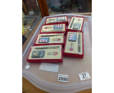 Tray of Zippo style lighters and pen sets