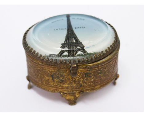A gilt metal and glass souvenir trinket box, length 16cm. Condition - feet out of shape, interior replaced, general wear.