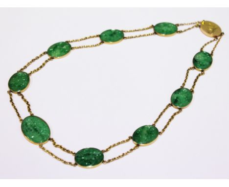 A Chinese 18ct gold jade necklace, length 44cm, gross wt. 24.5g