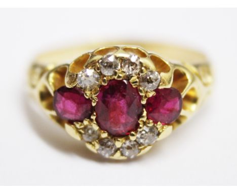 An 18ct gold diamond ruby ring, gross wt. 3.9g, size I