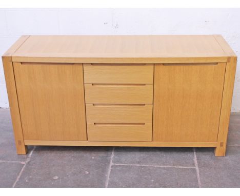 A Modernist light oak sideboard with recessed handles and visible joints. L154cm D52cm H78cm