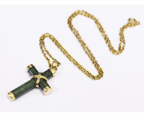 A 14ct gold jade crucifix pendant on chain, pendant length 3.6cm, chain length 44cm