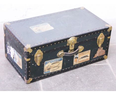 A vintage trunk having five Cunard White Star Line stickers attached. L79cm