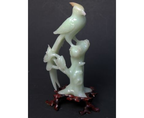 A Chinese carved jade bird on wooden stand, height 23cm. Condition - very good, no chips, cracks nor any signs of restoration