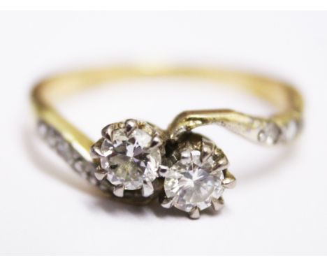 A yellow metal two stone diamond ring, approx. diamond wt. 0.40 carats, gross wt. 2.3g, size K