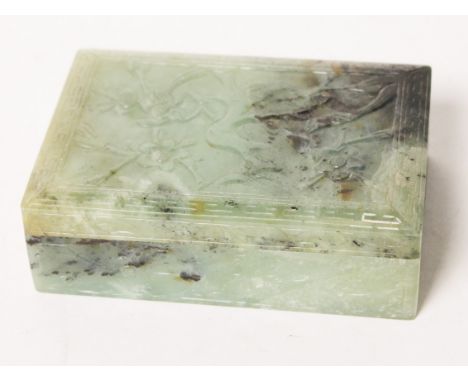 A Chinese carved jade box and cover, length 13cm. Condition - very good, no chips, cracks nor any repairs, general wear to in