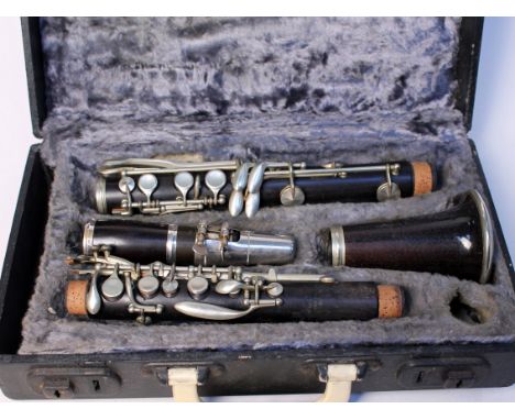 A Lucian Bassi rosewood and nickel plated clarinet with box. Condition - appears in good order but sold as seen.