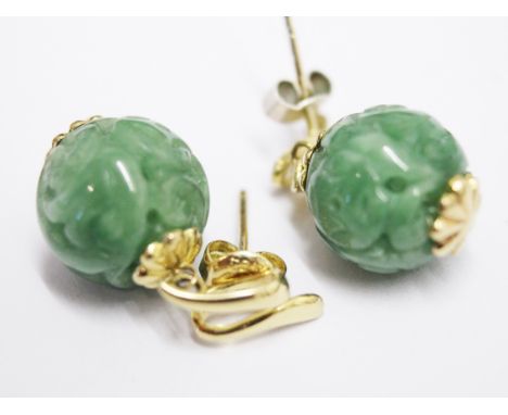 a pair of 14ct gold mounted carved jade earrings, gross wt. 5.4g