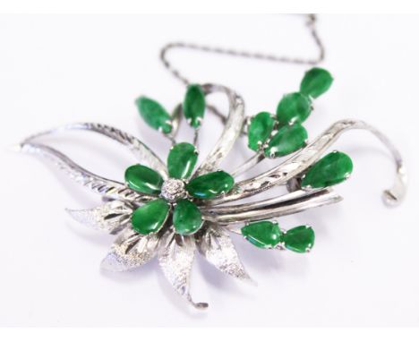 A 14ct white gold jade brooch, length 6.3cm, gross wt. 8.3g
