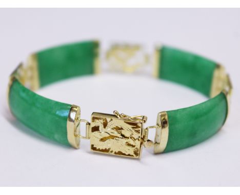 A Chinese 14ct gold jade bracelet, length 17.5cm, gross wt. 13.5g