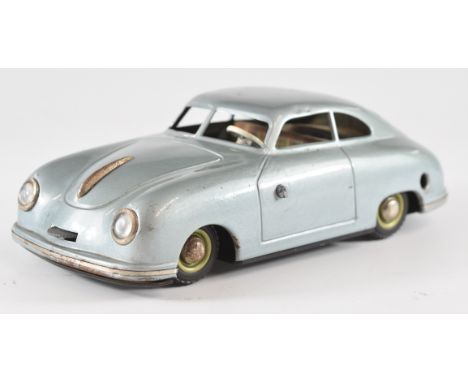 JNF Prototyp Porsche 356 tinplate clockwork car with metallic blue body and plaid interior.